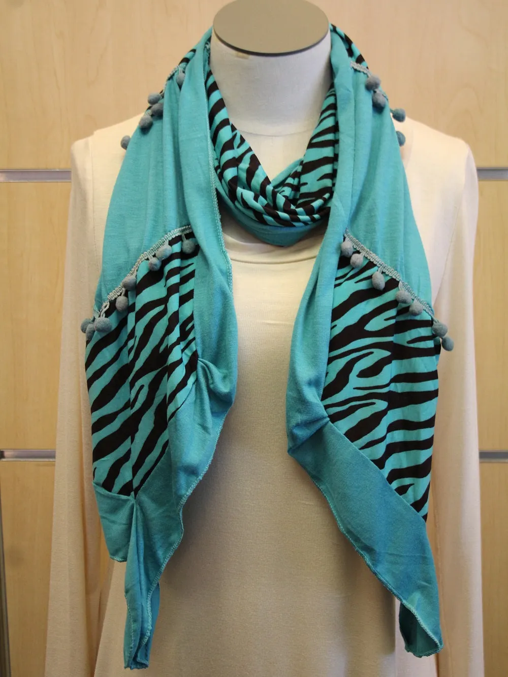 ADO | Wrap Blue Zebra Print Scarf with Blue Fuzz Balls