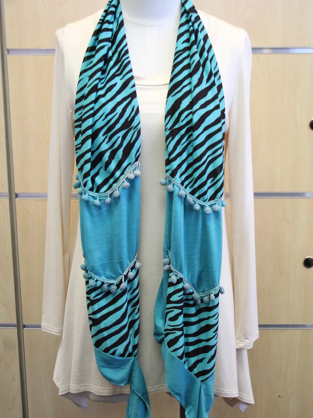 ADO | Wrap Blue Zebra Print Scarf with Blue Fuzz Balls